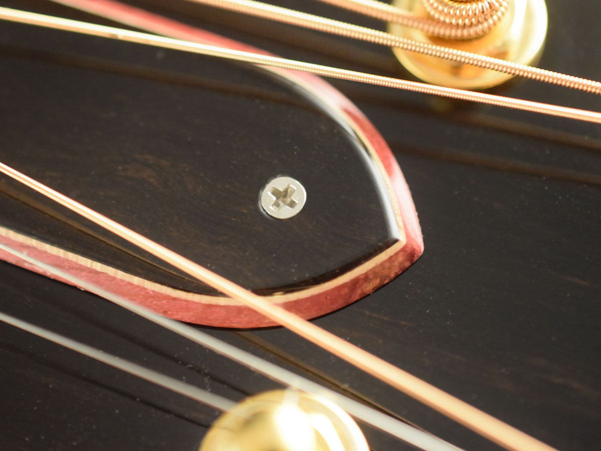 Laminated truss rod cover