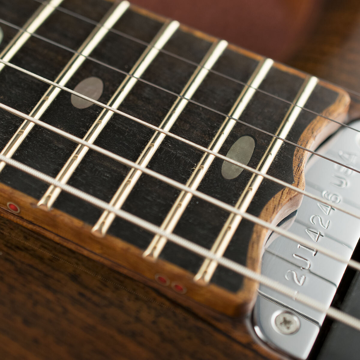 Mahogany binding on Ebony fingerboard