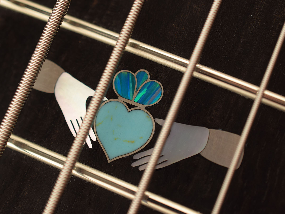 Claddaugh inlay in mother of pearl, recon turquoise, lab opal, and silver
