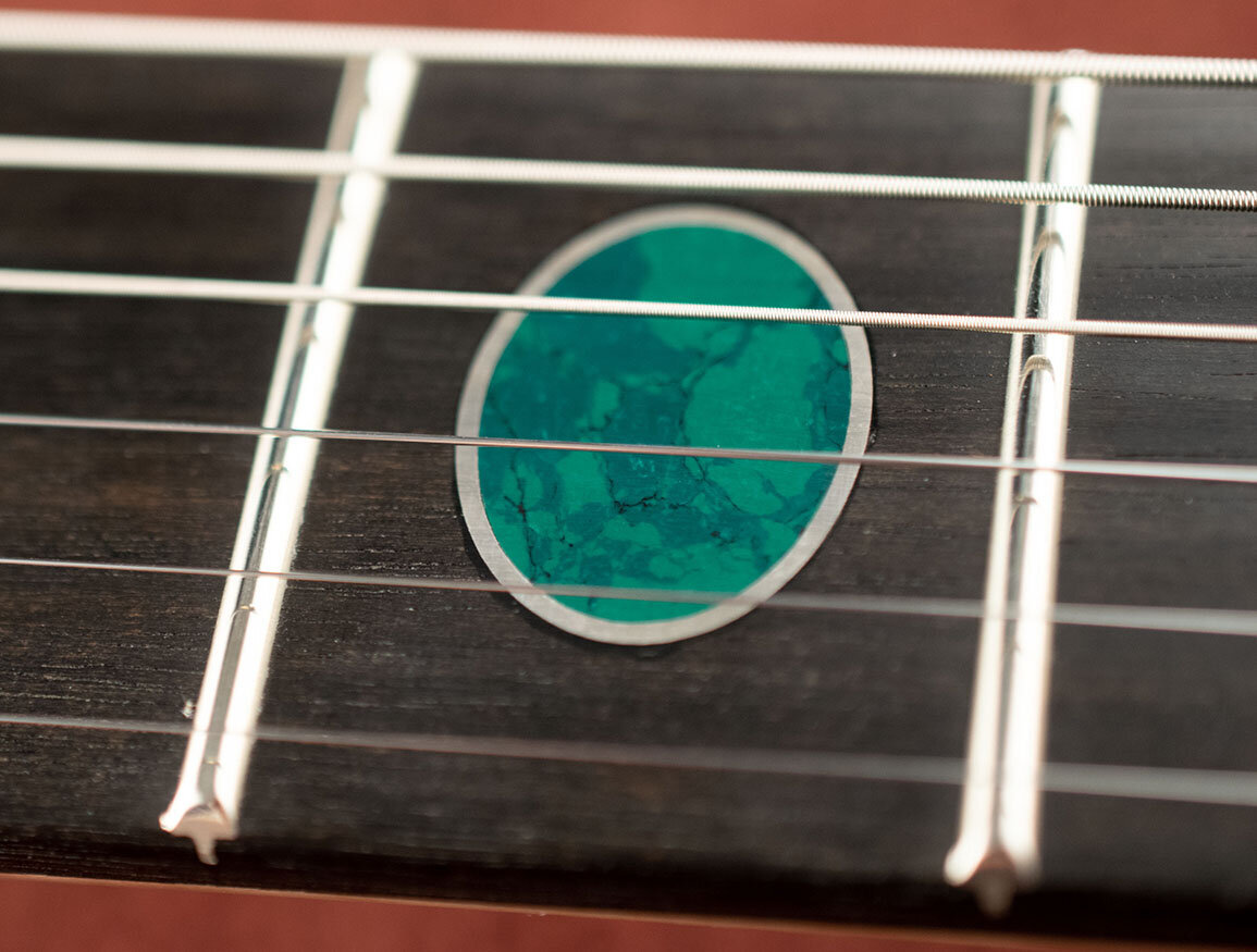Recon malachite oval wrapped in silver