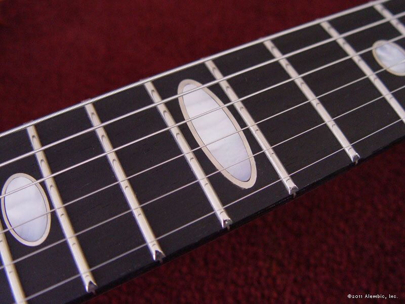 White mother of pearl oval wrapped in silver