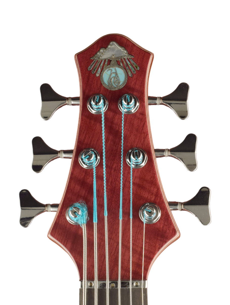 Silver inlaid logo with mother of pearl, recon turquoise plus abalone rays with silver lining